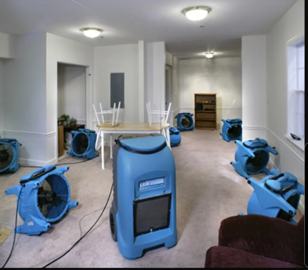 Air movers and dehumidifier setup for Water Damage Restoration in Marilla
